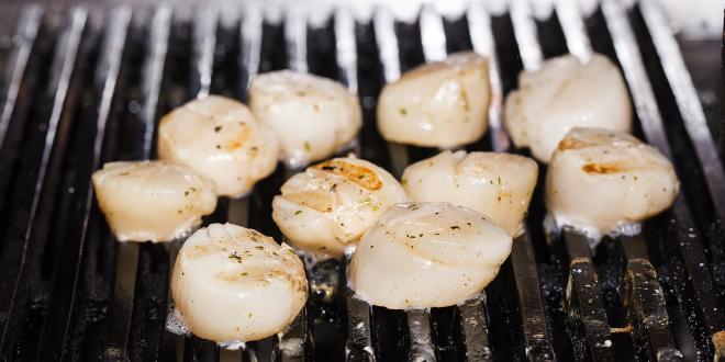 scallops cooking on a grill